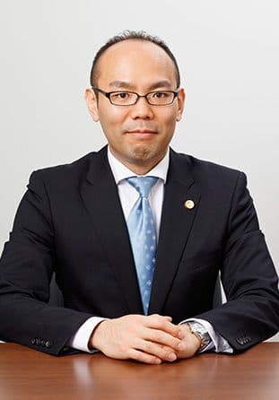 弁護士　根來 真一郎